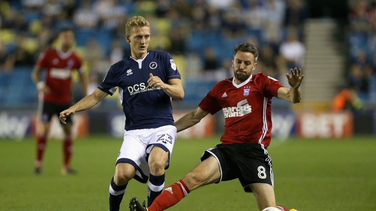 LONDON, ENGLAND - AUGUST 15: George Saville of Millwall takes the ball past Cole Skuse of Ipswich during the Sky Bet Championship match between Millwall