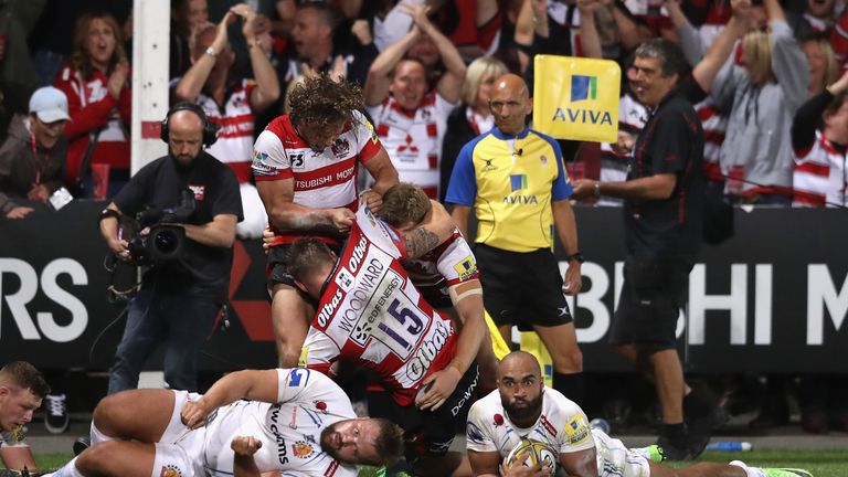 Gloucester celebrate after Jason Woodward scores the last minute, match winning try