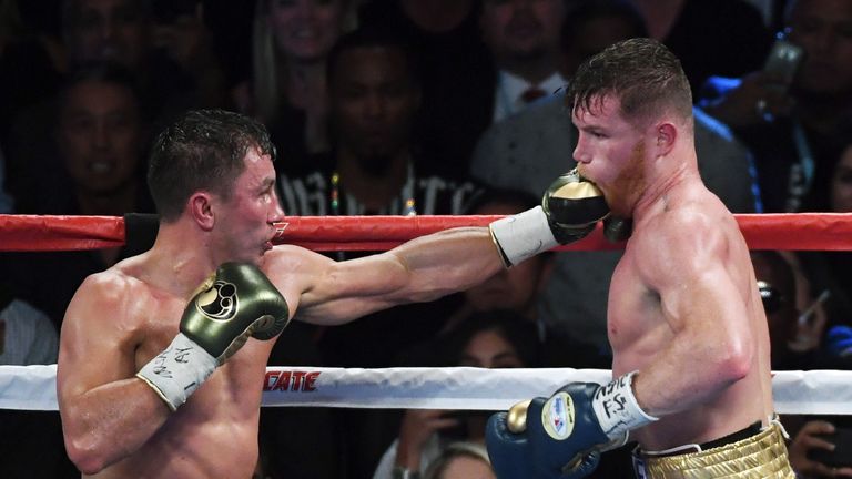 SEPTEMBER 16:  Gennady Golovkin (L) throws a left at Canelo Alvarez in the 12th round of their WBC, WBA and IBF middleweight championship bout
