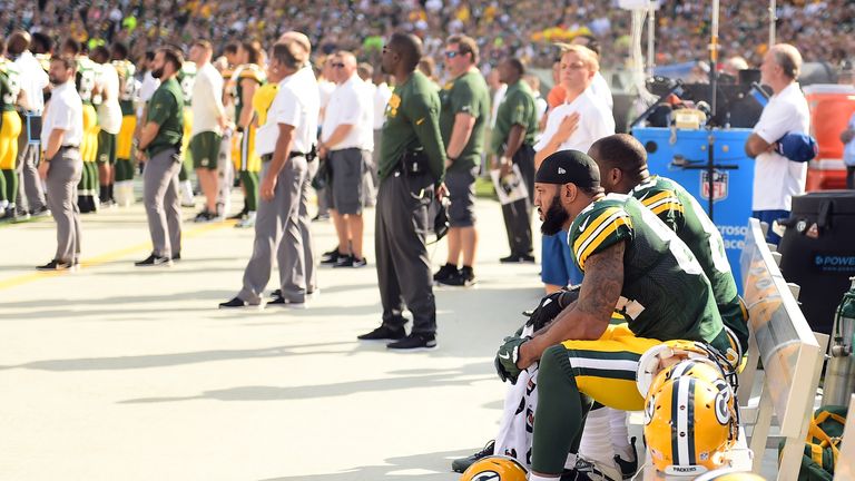 GREEN BAY, WI - SEPTEMBER 24:  Green Bay Packers players sit in protest during the national anthem prior to the game against the Cincinnati Bengals at Lamb