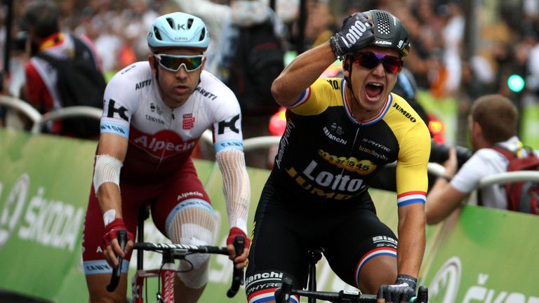 Dylan Groenewegen stood firm to survive a late burst of attacks