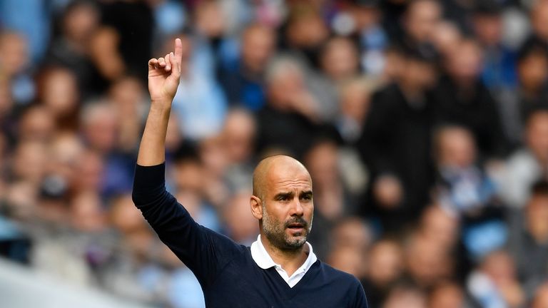 MANCHESTER, ENGLAND - SEPTEMBER 09: Josep Guardiola, Manager of Manchester City gives his team instructions during the Premier League match between Manches