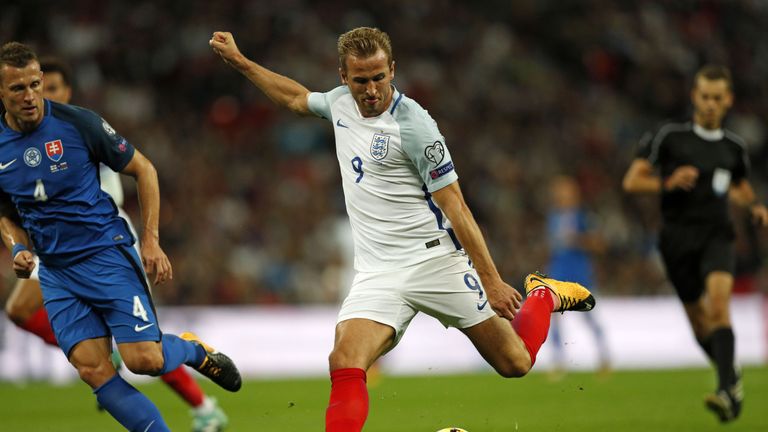 England's striker Harry Kane shoots against Slovakia