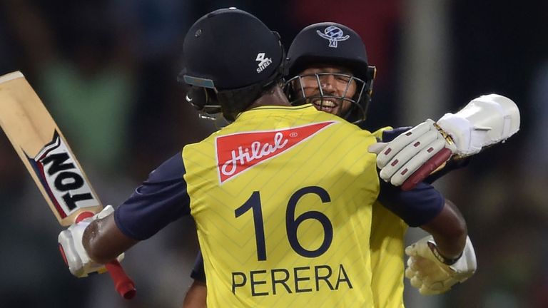 Thisara Perera and Hashim Amla celebrate the World XI's victory in the second T20