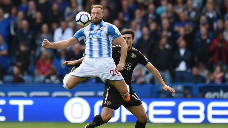 Laurent Depoitre controls the ball under pressure from Harry Maguire