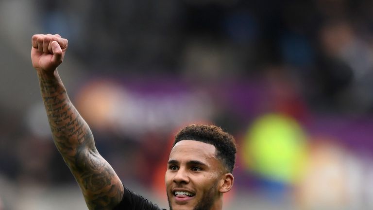 SWANSEA, WALES - SEPTEMBER 10:  Newcastle goalscorer Jamaal Lascelles celebrates on the final whistle during the Premier League match between Swansea City 