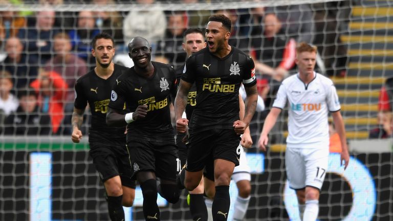 SWANSEA, WALES - SEPTEMBER 10:  Jamaal Lascelles of Newcastle United celebrates after he scores his sides first goal during the Premier League match betwee