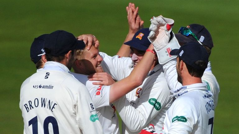 Essex seamer Jamie Porter is congratulated by his team-mates