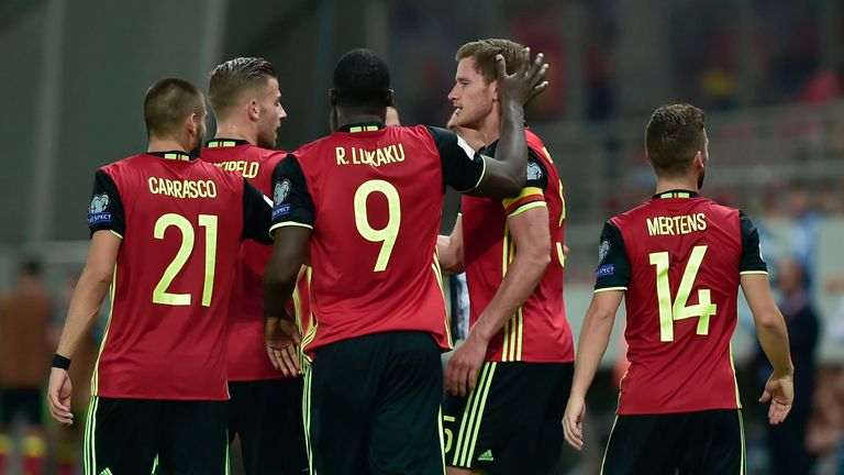 Belgium's Jan Vertonghen (C) celebrates with teammates after scoring the first goal during their Group H 2018 FIFA World Cup qualifying football match betw