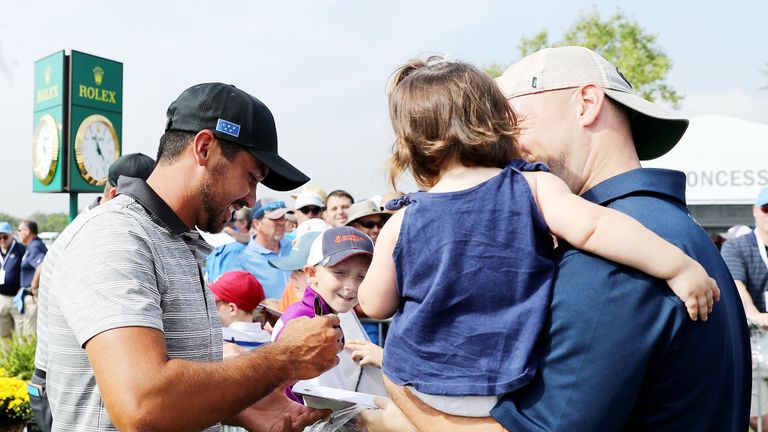 Jason Day of the International team signs autographs during a practice round prior to the Presidents Cup  on September 26, 2017, in New Jersey.