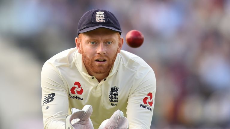 England's Jonny Bairstow gathers the ball during play on the third day of the third international Test match between England and West Indies at Lord's cric
