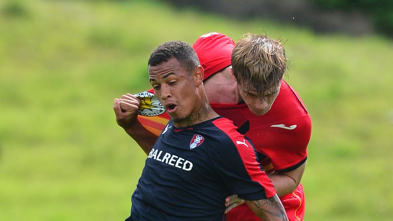 GLASGOW, SCOTLAND - JULY 25 : Liam Lindsay of Patrick Thistle challenges with Jonson Clarke-Harris of Rotherham during a pre season friendly match between 