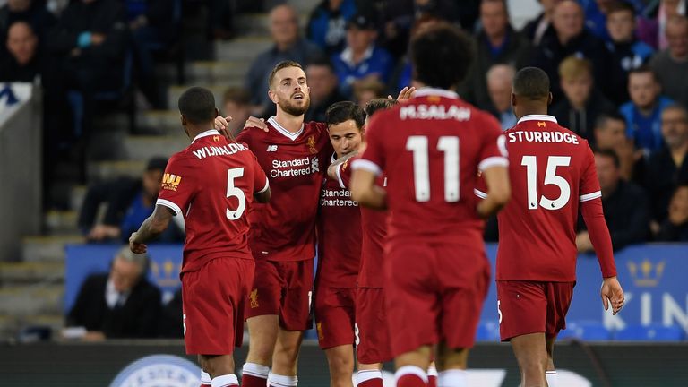 Jordan Henderson celebrates after scoring Liverpool's third goal at Leicester