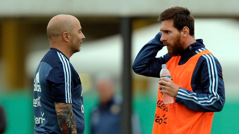 Argentina's forward Lionel Messi (R) talks with his coach Jorge Sampaoli during a training session in Ezeiza, Buenos Aires on August 28, 2017, ahead of a 2