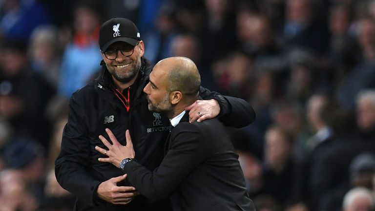 Liverpool's German manager Jurgen Klopp (L) greets Manchester City's Spanish manager Pep Guardiola after the English Premier League football match between 