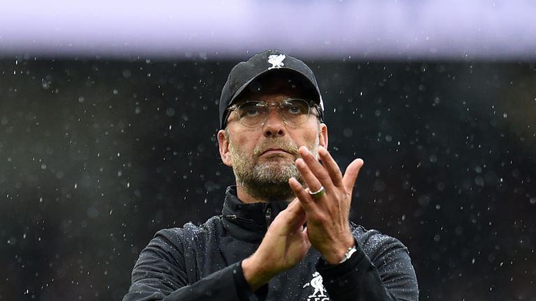 Liverpool's German manager Jurgen Klopp applauds supporters on the pitch after the English Premier League football match between Manchester City and Liverp
