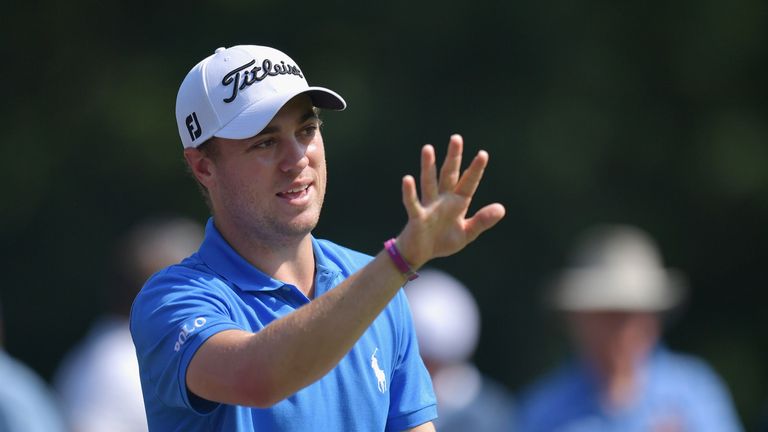 Justin Thomas of the United States waves to fans after playing his shot from the fourth tee during the final round of the Dell 