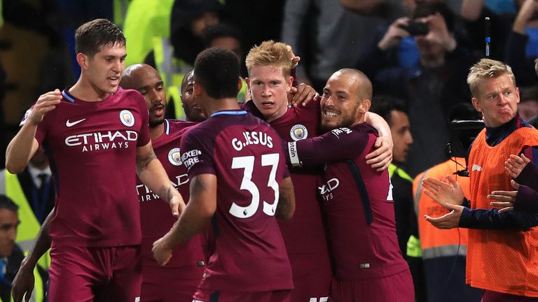 Kevin De Bruyne is congratulated by team-mates after giving Manchester City a 1-0 lead at Stamford Bridge