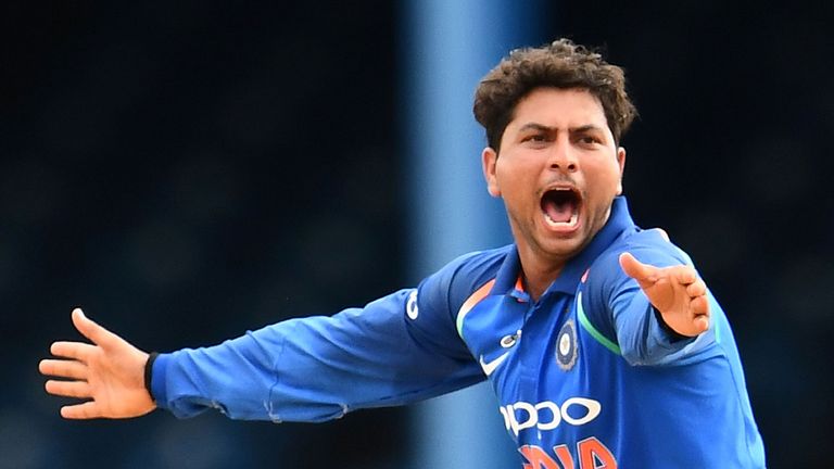 Kuldeep Yadav was mobbed by his team-mates after taking his hat-trick