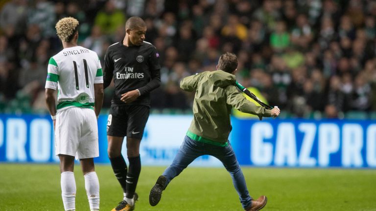 Celtic fan ran on the pitch and aimed a kick at Kylian Mbappe of Paris Saint Germain