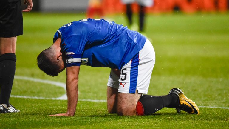 Lee Wallace goes down with an injury at Firhill on 15 September