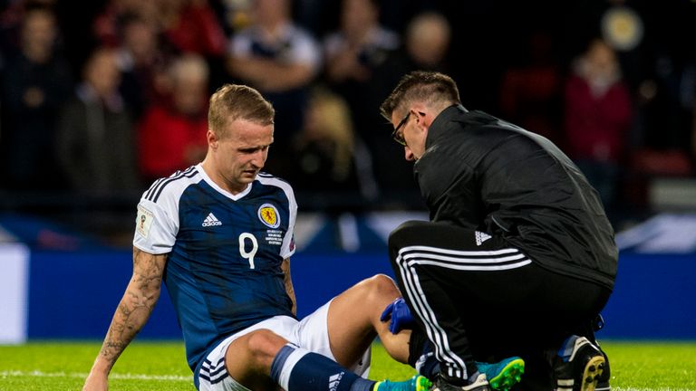 Leigh Griffiths is treated for his calf injury against Malta in September 2017