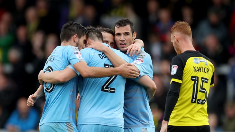 Leo Bonatini celebrates with team-mates after putting Wolves 4-0 up away to Burton