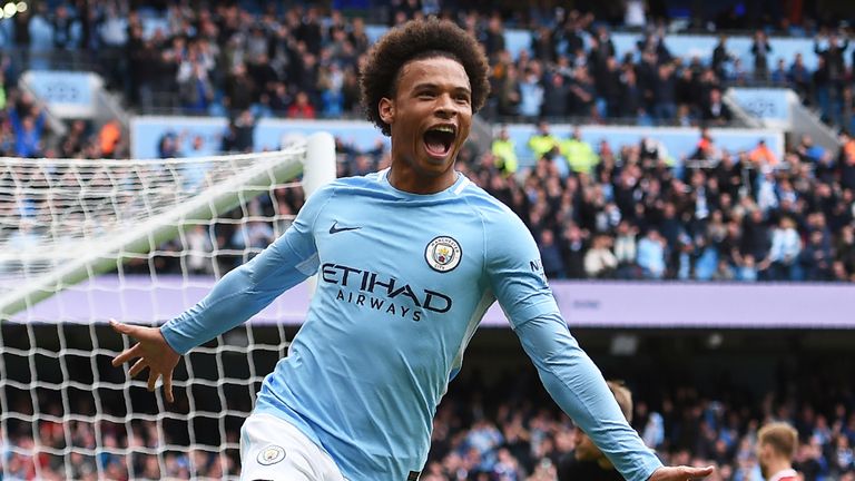 Leroy Sane celebrates after scoring Manchester City's fourth goal during the Premier League match against Liverpool