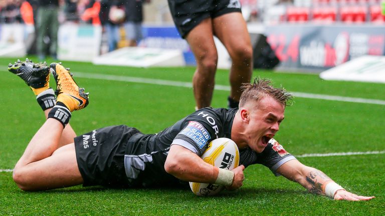 Catalans' Lewis Tierney scores a try in the Millions Pound game