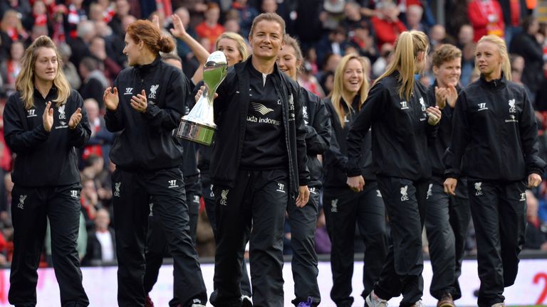Liverpool Ladies football team players parade with the Women's Premier League trophy before the start of the English Premier League football match between 