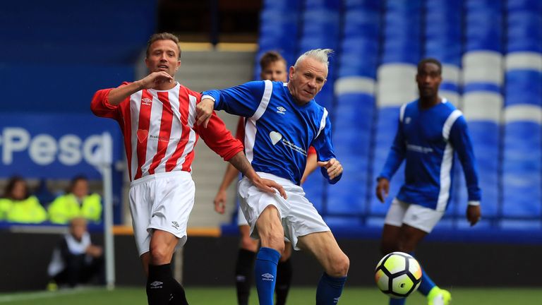 Michael Gray and Peter Reid (right) battle for the ball during the Bradley Lowery charity match at Goodison Park, Liverpool.