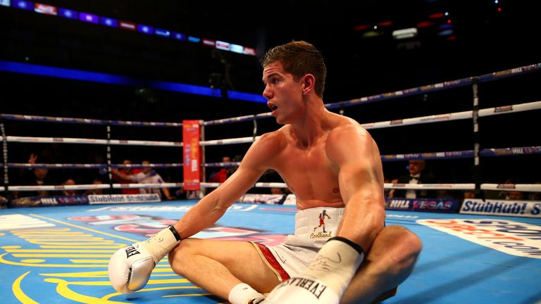 Luke Campbell sits on the canvas after being put down by Yvan Mendy in the WBC International Lightweight Championship fight