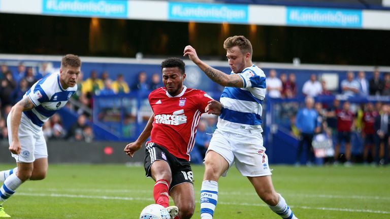 LONDON, ENGLAND - SEPTEMBER 09: Grant Ward of Ipswich Town and Luke Freeman of Queens Park Rangers battle for possession during the Sky Bet Championship ma