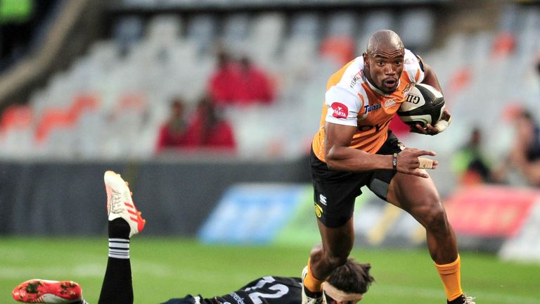 .Toyota Cheetahs vs Ospreys.Cheetahs' Makazola Mapimpi with James Hook of the Ospreys.