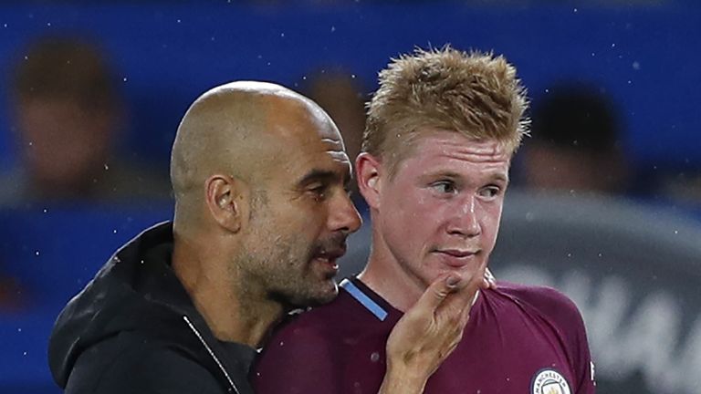 Manchester City's Spanish manager Pep Guardiola congratulates Manchester City's Belgian midfielder Kevin De Bruyne on the pitch after during the English Pr