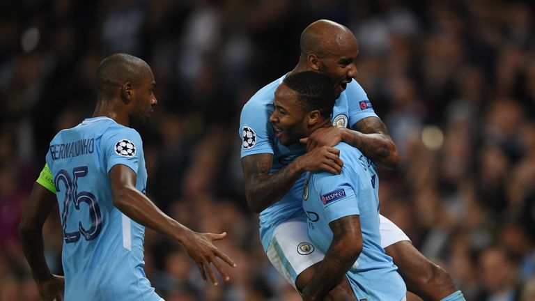 MANCHESTER, ENGLAND - SEPTEMBER 26: Raheem Sterling of Manchester City celebrates scoring his sides second goal with Fabian Delph of Manchester City and Fe