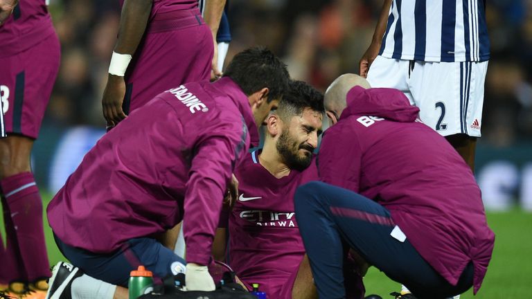Ilkay Gundogan receives treatment after picking up an injury against West Brom