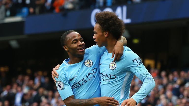 MANCHESTER, ENGLAND - SEPTEMBER 23:  Raheem Sterling (L) of Manchester City celebrates scoring his sides second goal with his team mate Leroy Sane (R) duri