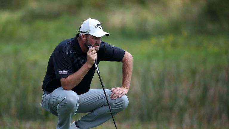 Marc Leishman of Australia lines up a putt on the sixth green during the third round of the BMW Championship at Conway Farms