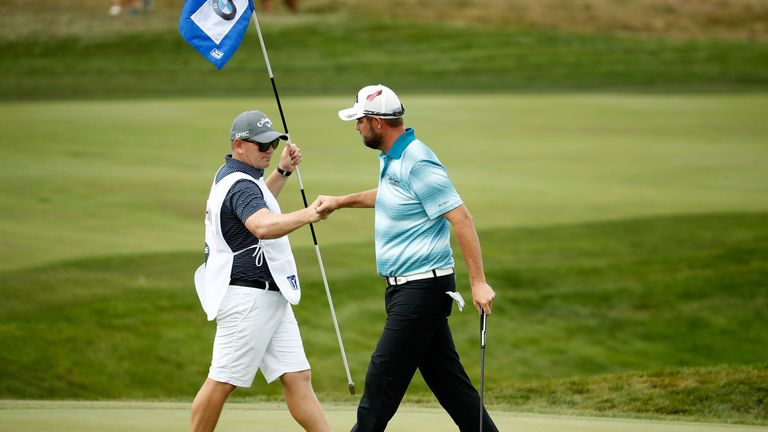 LAKE FOREST, IL - SEPTEMBER 17:  Marc Leishman of Australia celebrates a birdie with his caddie Matt Kelly after making birdie on the eighth hole during th