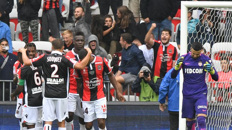 Nice's Italian forward Mario Balotelli (4th L) celebrates with teammates after scoring a penalty kick during the French L1 football match between Nice (OGC