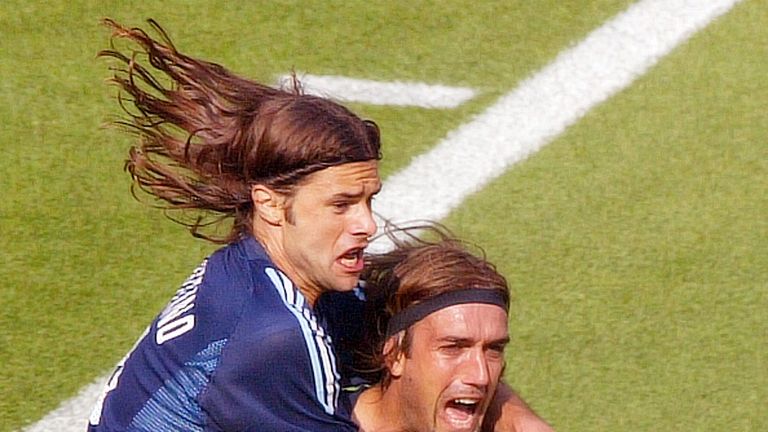 Argentina forward Gabriel Batistuta (right) is congratulated by his teammate Mauricio Pochettino after scoring at 2002 World Cup