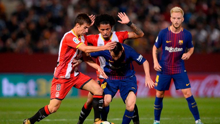Lionel Messi (middle) was given little time on the ball in Girona