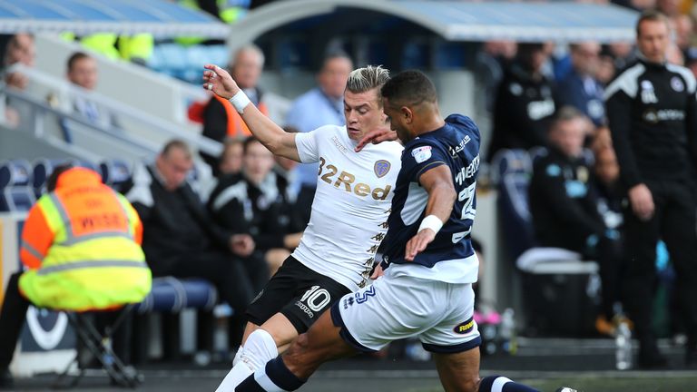 Ezgjan Alioski (left) is tackled by James Meredith during the Sky Bet Championship match at The Den