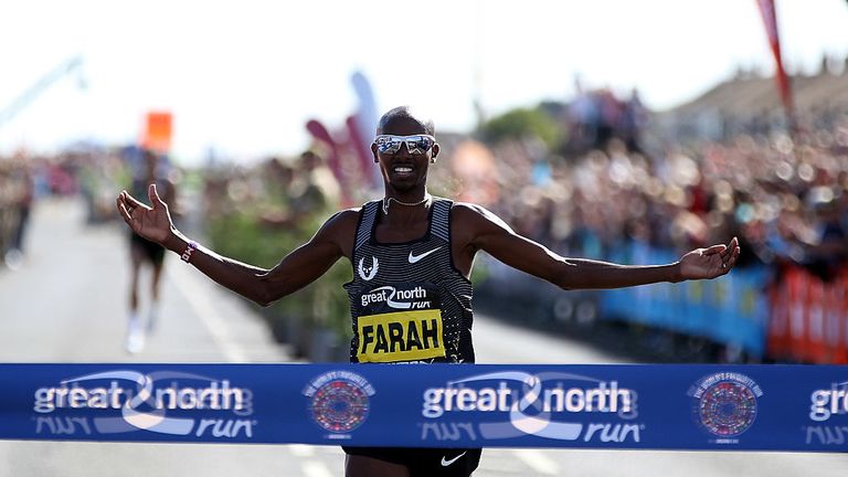 Mo Farah of Britain celebrates winning The Great North Run on September 11, 2016 in Newcastle upon Tyne