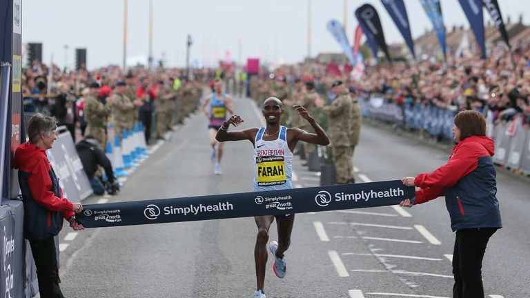 Mo Farah celebrates after his fourth successive Great North Run win