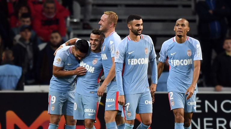Monaco's Colombian forward Radamel Falcao (L) celebrates with teammates after scoring a goal during the French L1 football match between Lille OSC (LOSC) a