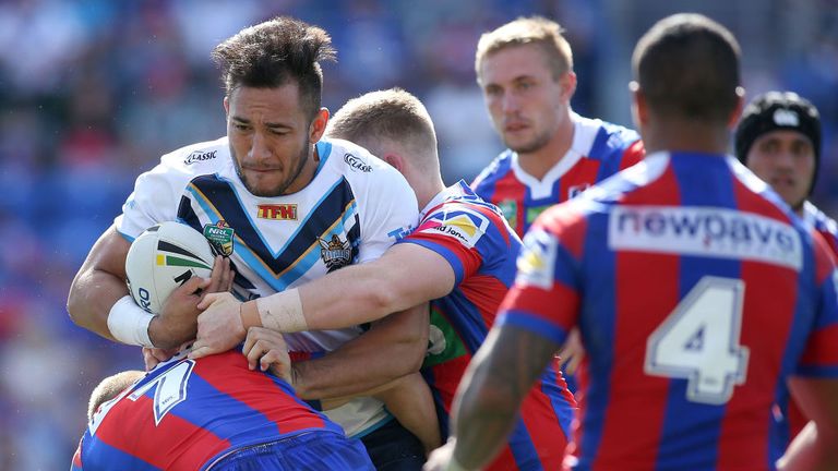 Nathaniel Peteru of the Titans is tackled by the Knights defence during the round two NRL match between the Newcastle Knights