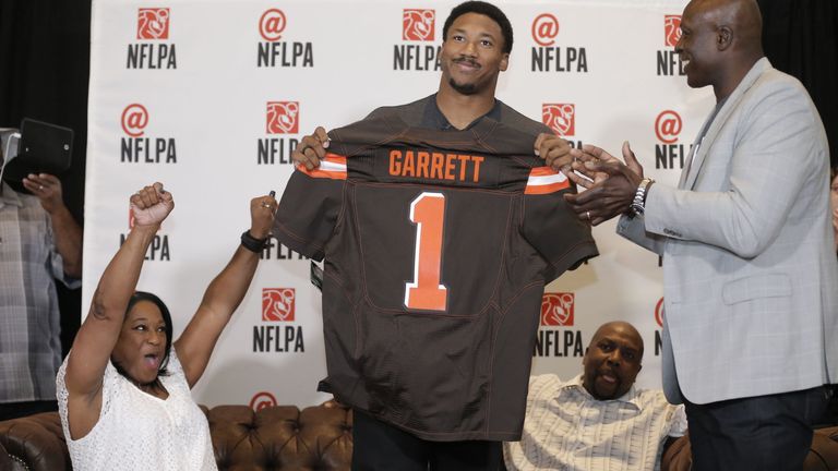 IMAGE DISTRIBUTED FOR FOR NFLPA - Former No. 1 overall pick Bruce Smith (right) presents a Cleveland Browns jersey to Myles Garrett while his mother Audrey