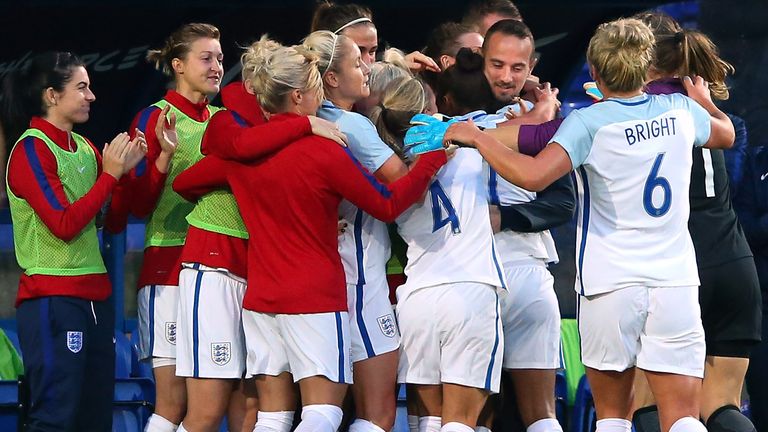 Nikita Parris celebrates with Mark Sampson after putting England ahead